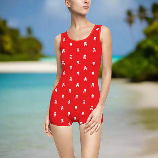 Model wearing bright red one piece with a fun pirate skull pattern print. No doubt looking for pirate booty.