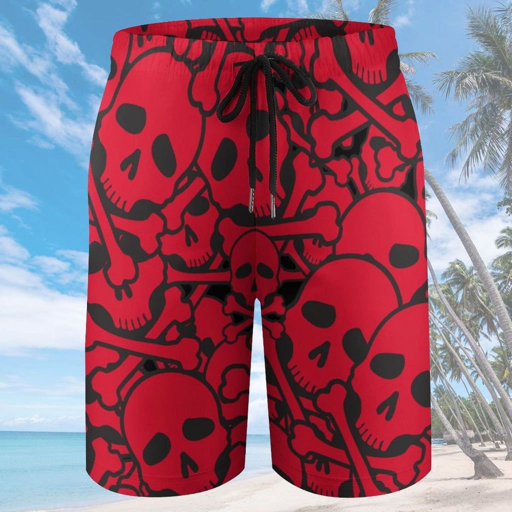 Red and black skull-patterned shorts on a beach background