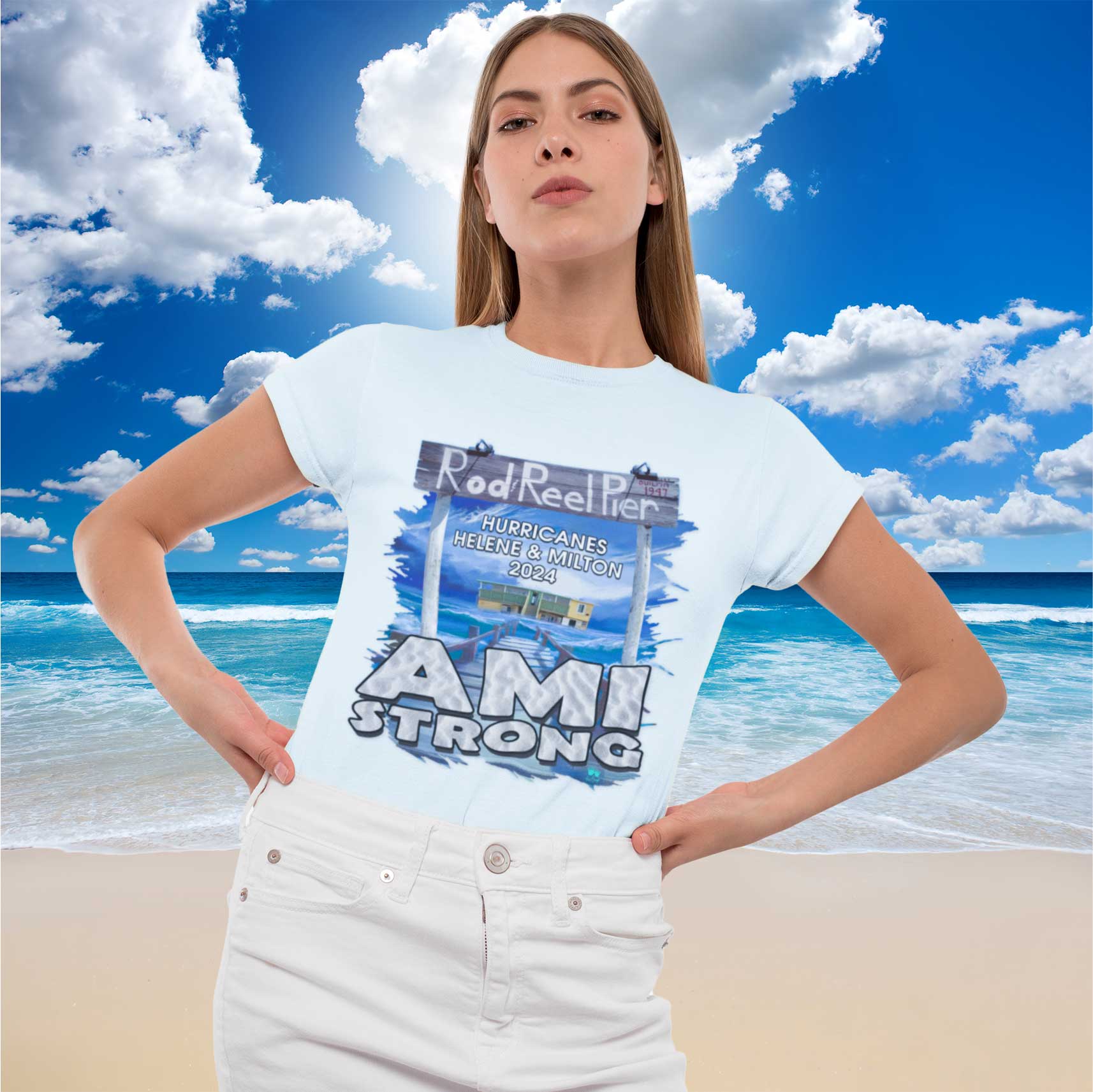 Woman wearing a 'AMI Strong' t-shirt with a beach and blue sky background