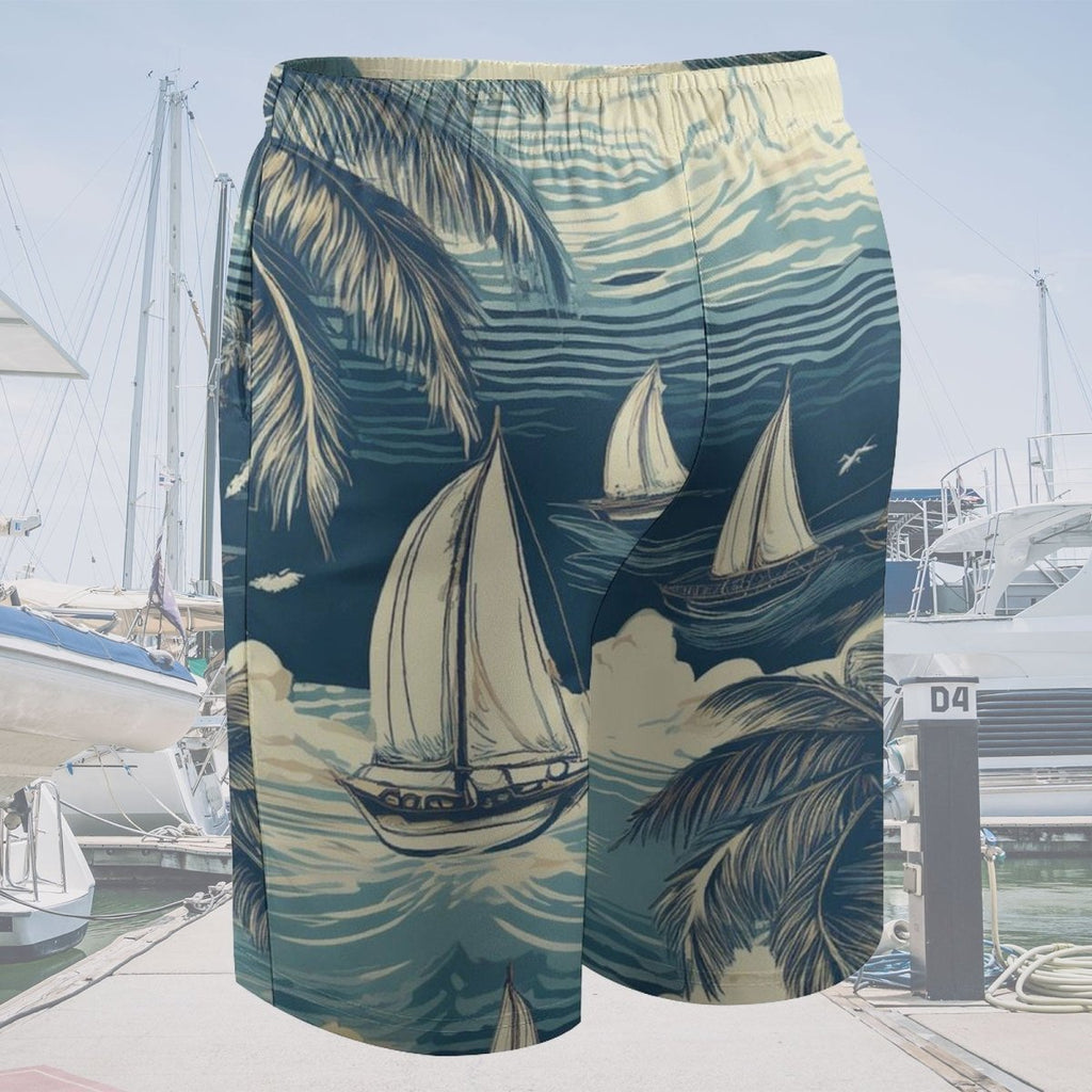 Beach shorts with sailboat and palm tree design in front of a marina.