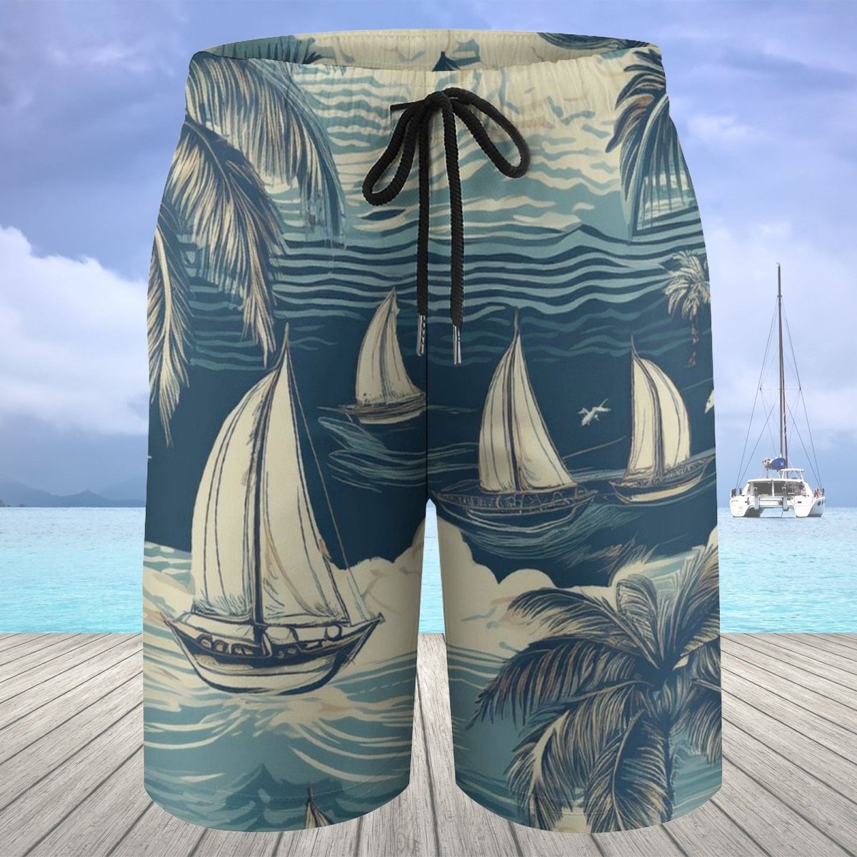 Beach shorts with sailboat and palm tree design on a wooden deck with ocean view