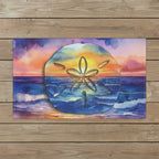 Colorful sand dollar design on a watercolor background tea towel layin on a rustic wood deck