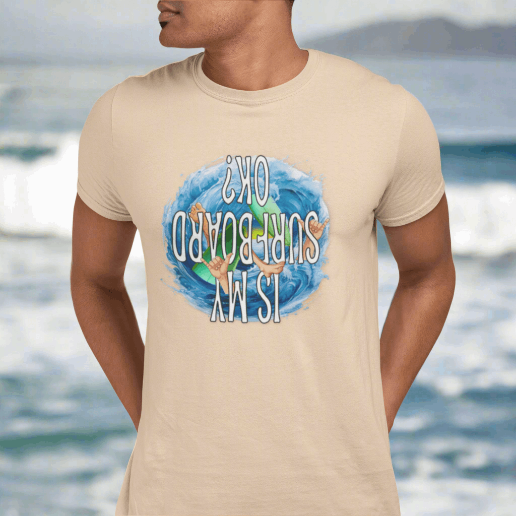 Surfer in Honolulu wearing a sand dune colored t-shirt featuring a wipeout and begging the question Is My Surfboard OK?