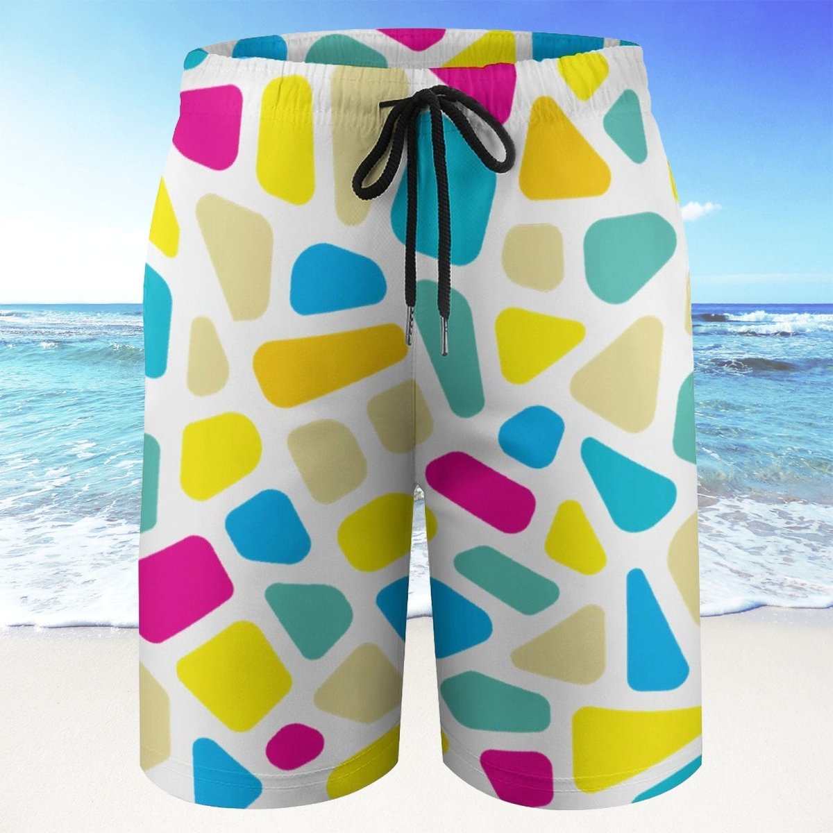Colorful geometric patterned shorts with a beach background