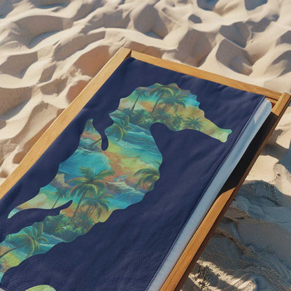 Navy Blue beach towel laying on a beach lounger on a sandy beach