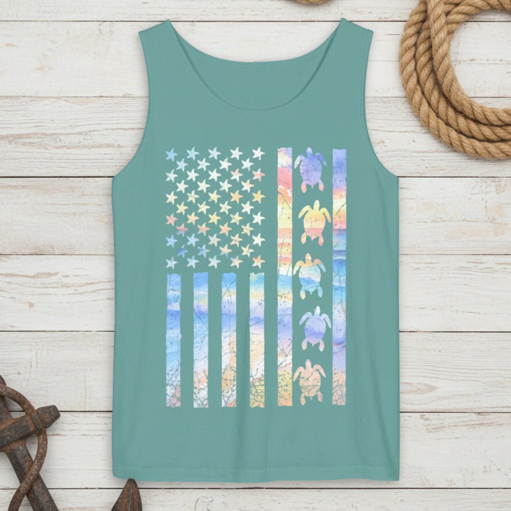 Teal tank top with a colorful American flag design featuring stars and turtles on a rustic nautical wood background