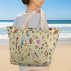 Person holding a tote bag with shell pattern on the beach