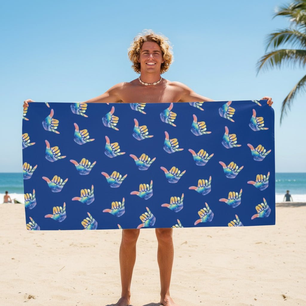 surfer dude holding up a beach-towel on La Jolla Beach 