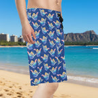 Dude wearing deep blue board shorts with colorful shaka hand signs pattern standing on Waikiki Beach
