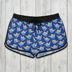 Blue patterned shaka shorts on a rustic wood background