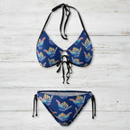 Blue bikini set with colorful shaka hand signs on a white nautical wood background