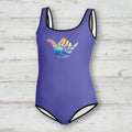 Purple swimsuit with a colorful wave design on a nautical wood background