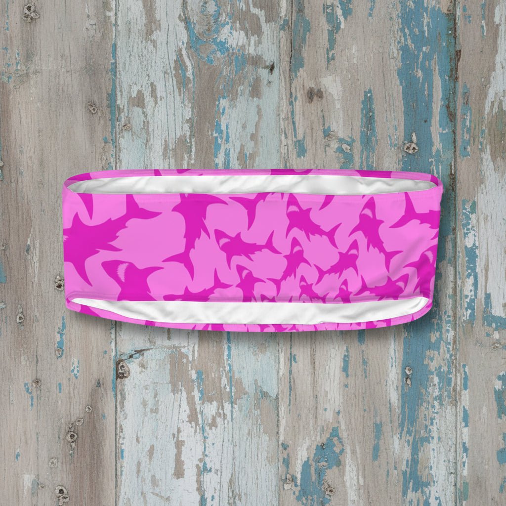 Pink shark patterned tube top on a rustic wood background