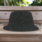 Back Bucket hat with subtle shark pattern sitting on a park bench in Key West