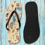 Flip-flop with shell pattern on a wooden surface
