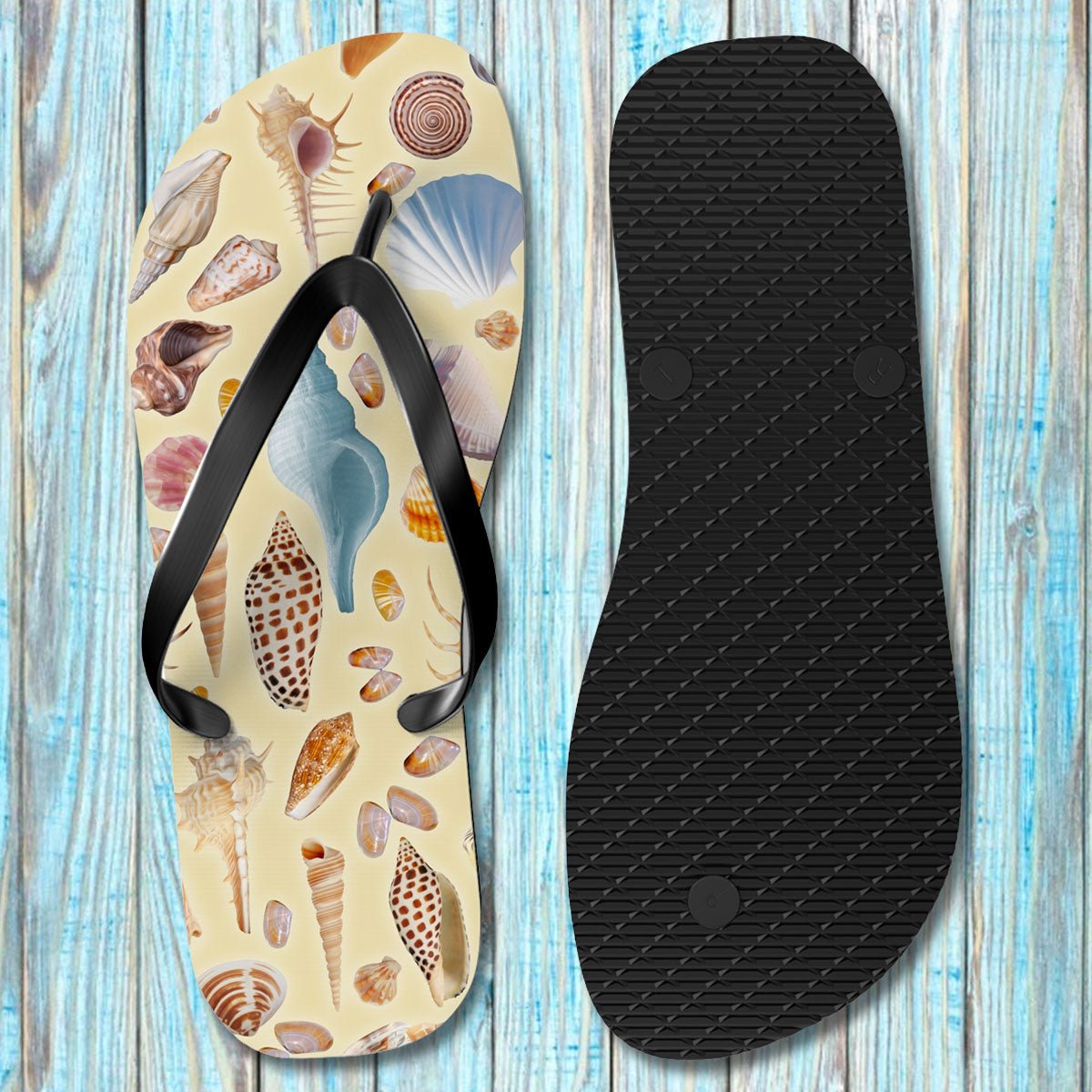 Flip-flop with shell pattern on a wooden surface