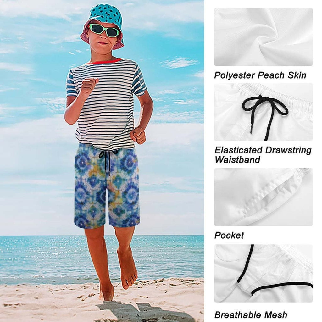 Child wearing a striped shirt, floral shorts, and a bucket hat on a beach with fabric details shown.