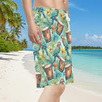 Dude wearing Tropical-themed board shorts with parrots and drums on Caribbean Island Beach
