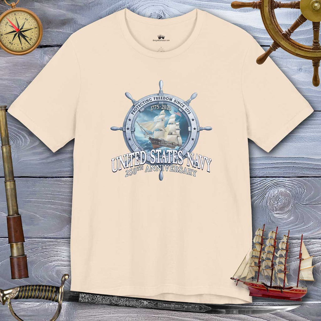 Beige t-shirt with United States Navy graphic on a wooden background with nautical items.