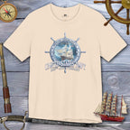 Beige t-shirt with United States Navy graphic on a wooden background with nautical items.