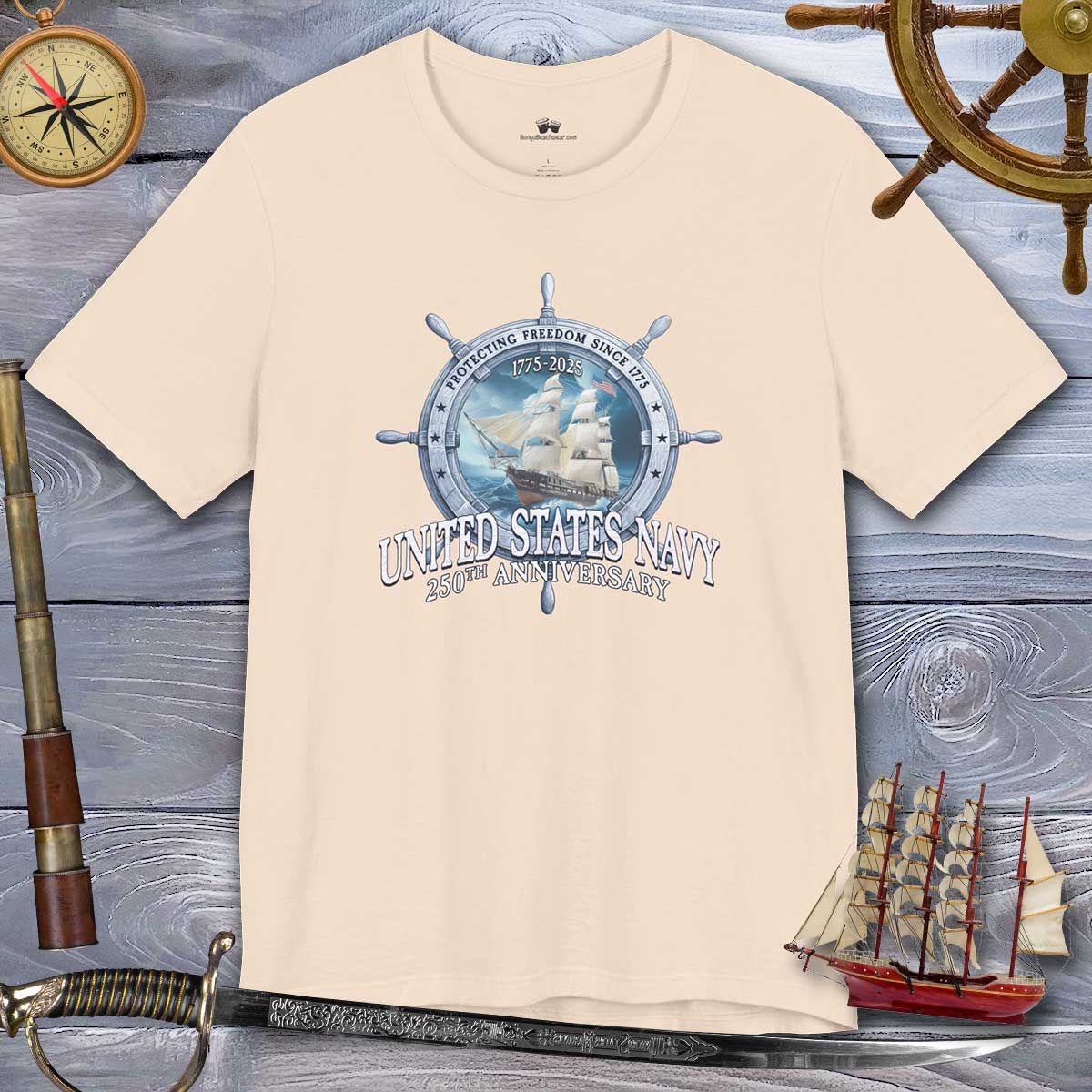 Beige t-shirt with United States Navy graphic on a wooden background with nautical items.