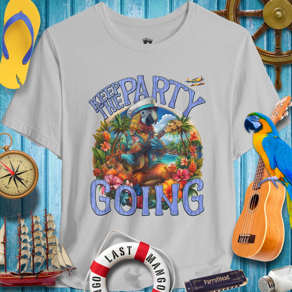 Tropical graphic tee featuring colorful parrot design with 'Keep the Party Going' text, perfect for summer celebrations.