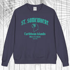 A navy blue crewneck sweatshirt with a teal graphic print reading 'ST. SOMEWHERE Caribbean Islands Where It's Warm Since 1994' and a bird silhouette, displayed flat against a white wood plank background.