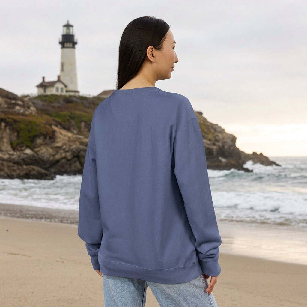Woman wearing a blue sweatshirt on a New England Beach 