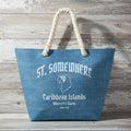 Blue tote bag with 'St. Somewhere Caribbean Islands' text and logo on a rustic wood background