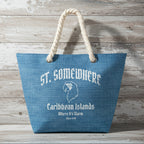 Blue tote bag with 'St. Somewhere Caribbean Islands' text and logo on a rustic wood background