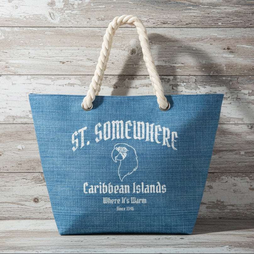 Blue tote bag with 'St. Somewhere Caribbean Islands' text and logo on a rustic wood background