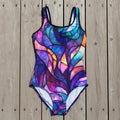Colorful stained glass patterned swimsuit on a nautical wood deck