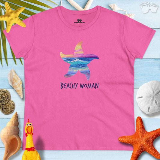 Bright pink t-shirt with a starfish design and 'BEACHY WOMAN' text, perfect for summer and beach getaways.