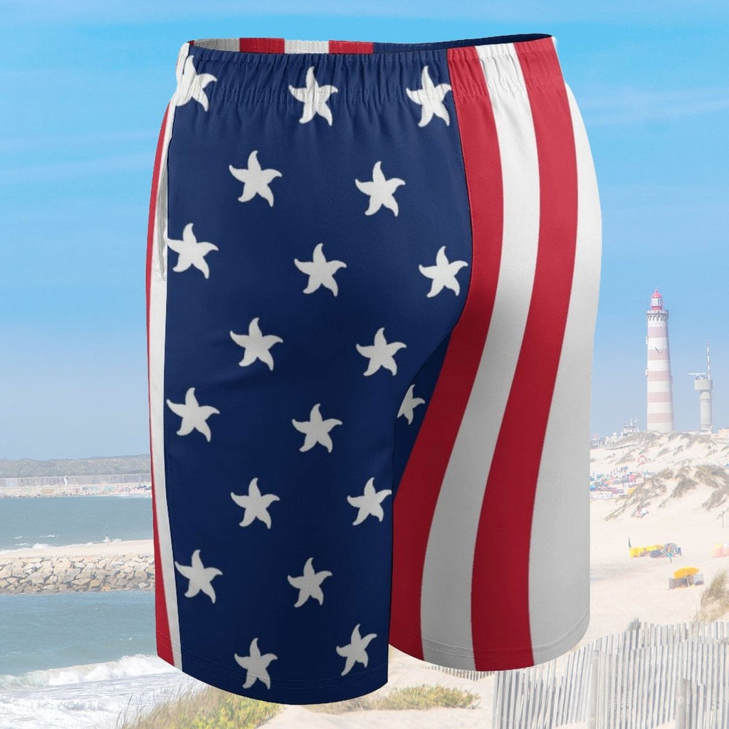American flag-themed shorts with a lighthouse and beach in the background