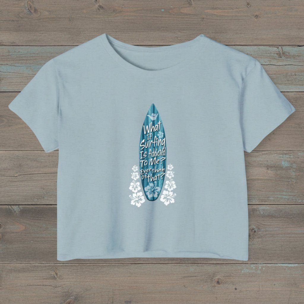 Stonewash Denim blue cropped t-shirt with funny surfer text on a rustic wood  background