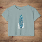 Stonewash Green crop-top shirt with surf humor text on a rustic wood background