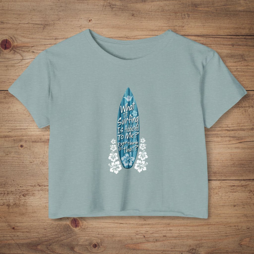 Stonewash Green crop-top shirt with surf humor text on a rustic wood background