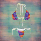 Colorful tie-dye bikini set on a nautical wood background
