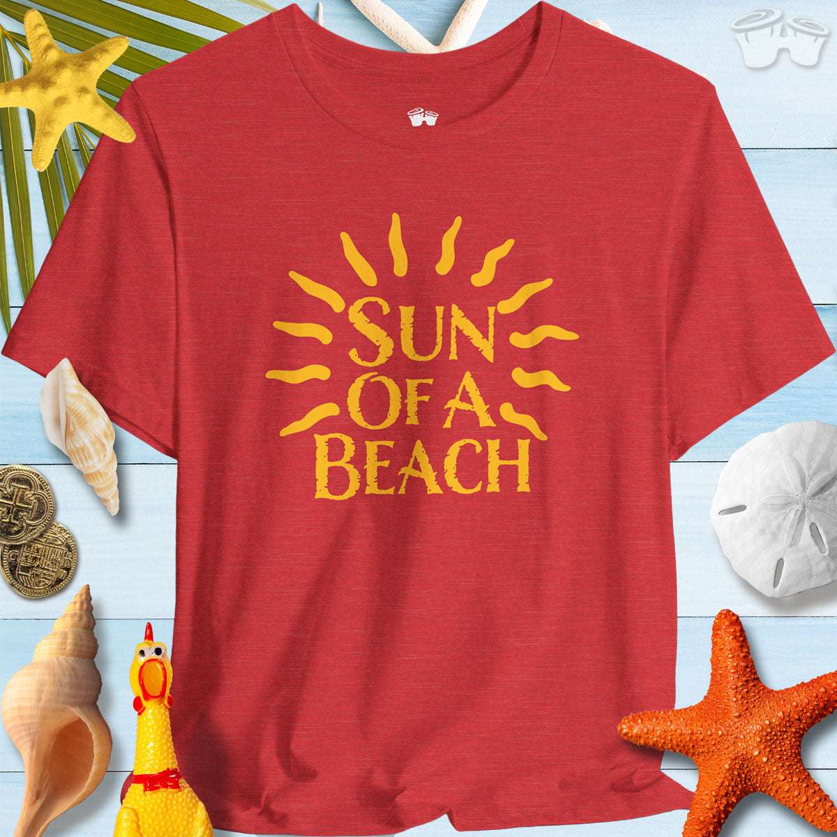 Sun Of A Beach Bella Canvas Tee shirt displayed with beach-themed decorations and summer vibes.