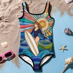 Surfer in the Sun - exclusive surreal art by Bongo Beachwear on this cute girls bathing suit laying in sand surrounded by seashells and  pair of pink sunglasses