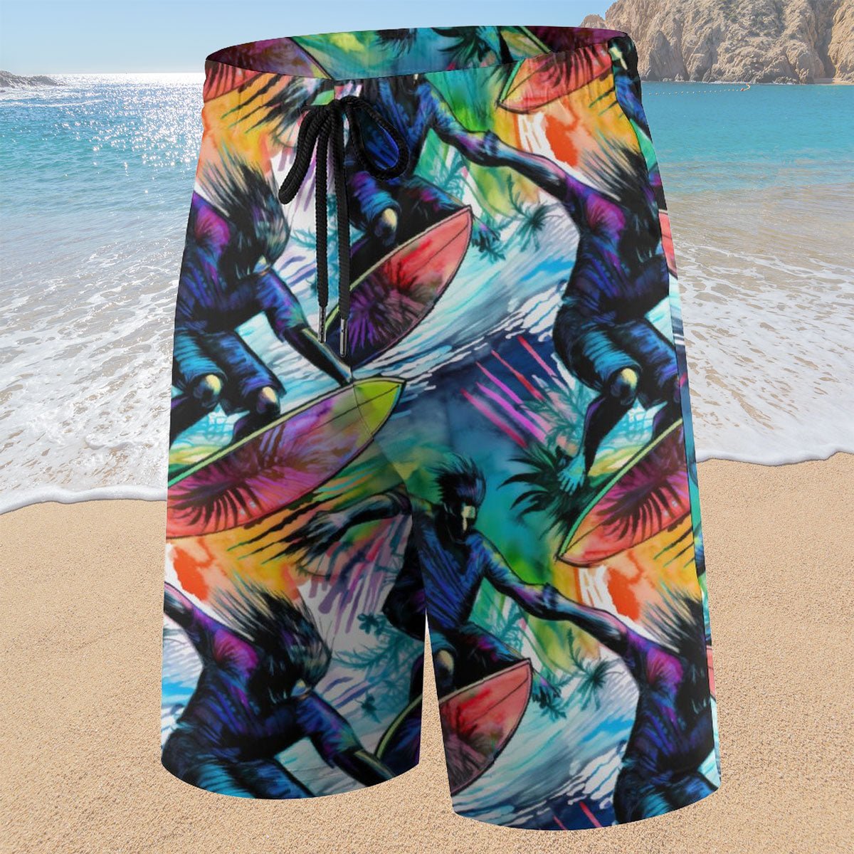 Colorful beach shorts with a surfer design on a sandy beach background