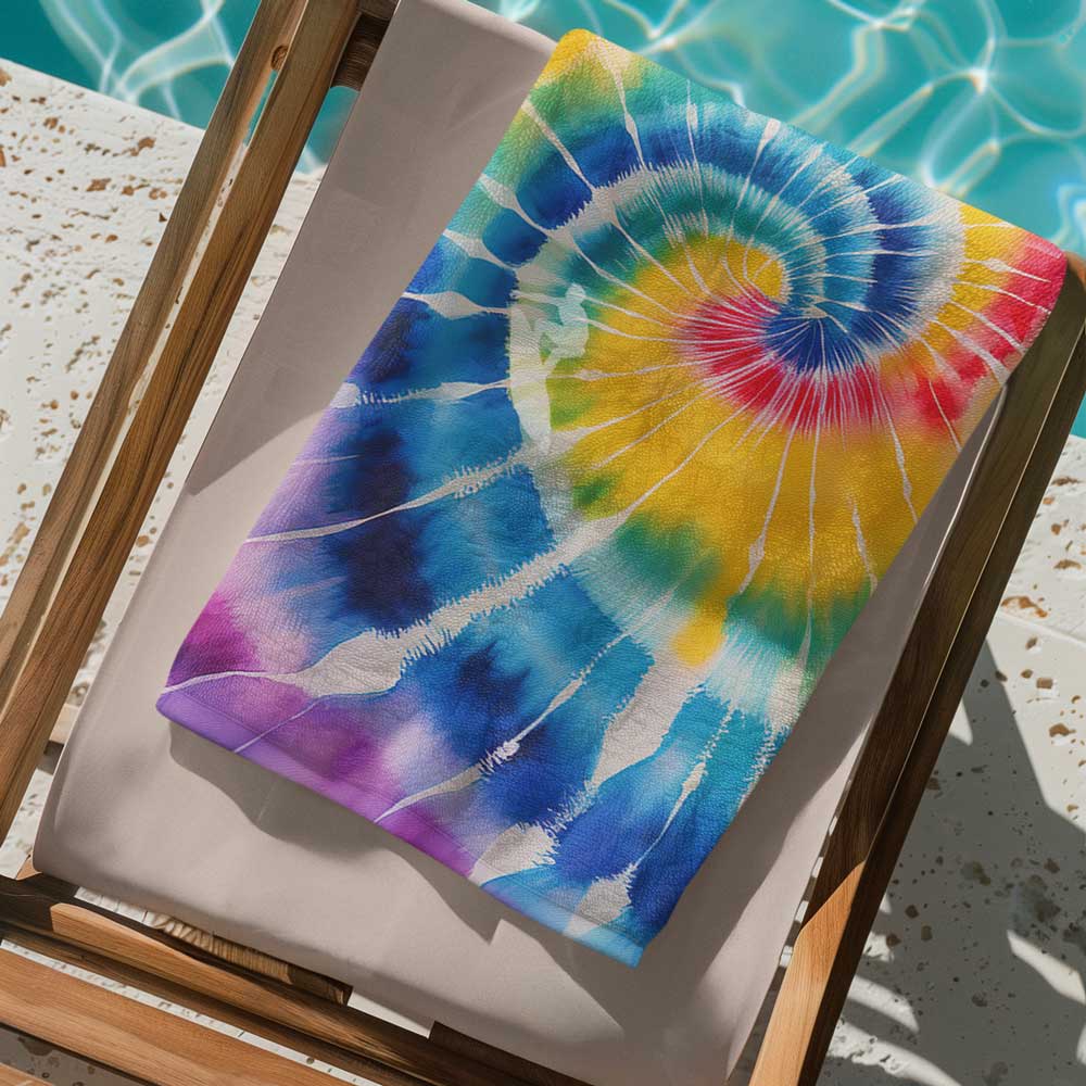 Surfers Beach towel folded up and placed on a poolside beach chair