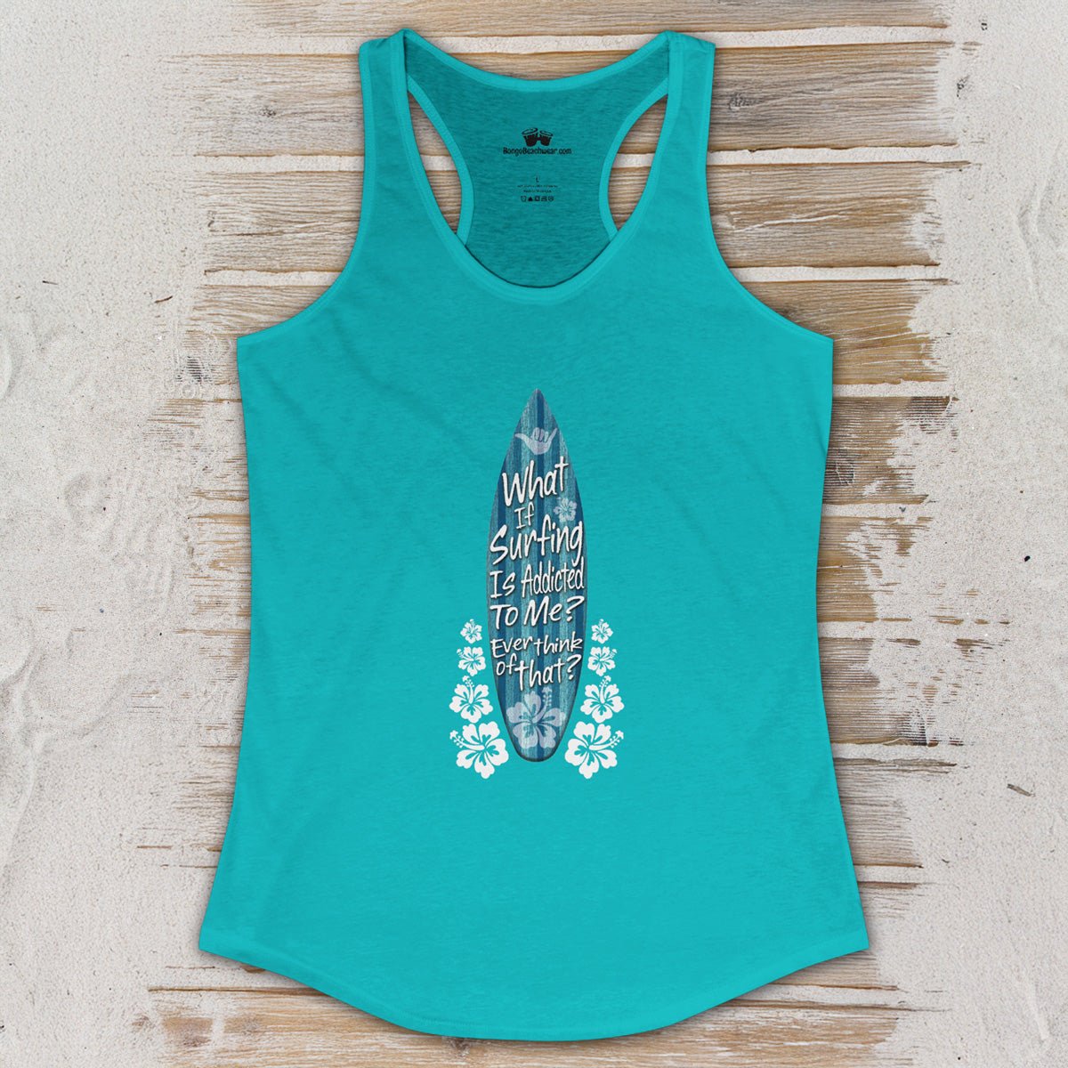 Teal tank top with a graphic design on a wooden surface