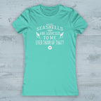 Mint green t-shirt with white text on a nautical wood background