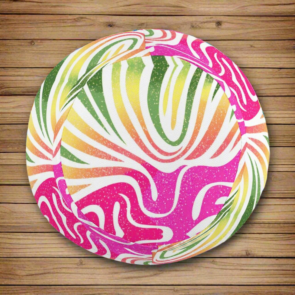 Colorful bucket hat with a vibrant coral pattern on a nautical wood  background
