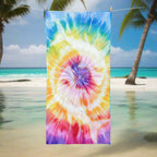 Tie Dye beach towel with ghostly yin-yang shark imprint hanging on a close line a the beach