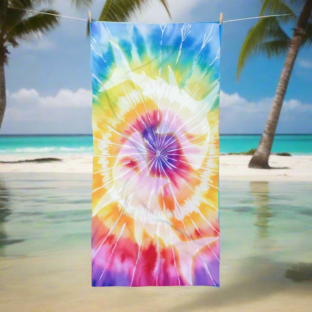 Tie Dye beach towel with ghostly yin-yang shark imprint hanging on a close line a the beach