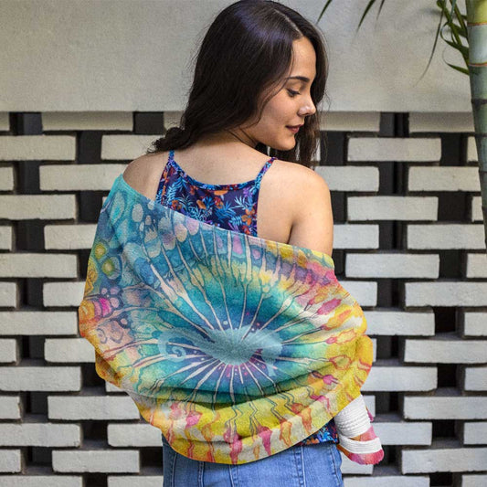 Swimwear model wrapped in a Bongo Beachwear Tie-Dye Beach Towel featuring a seahorse silhouette. 