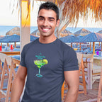 Man wearing a t-shirt with a Margarita graphic that says "this one's for Jimmy" (Buffett) in a beachside Tiki Bar
