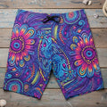 Colorful tiki tribal patterned shorts on a nautical wood background